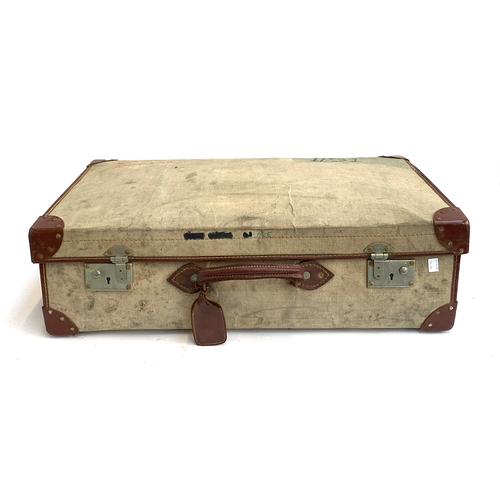 1092 - A military issue canvas and leather suitcase, marked Cpl Weeks, 72x41x22cm