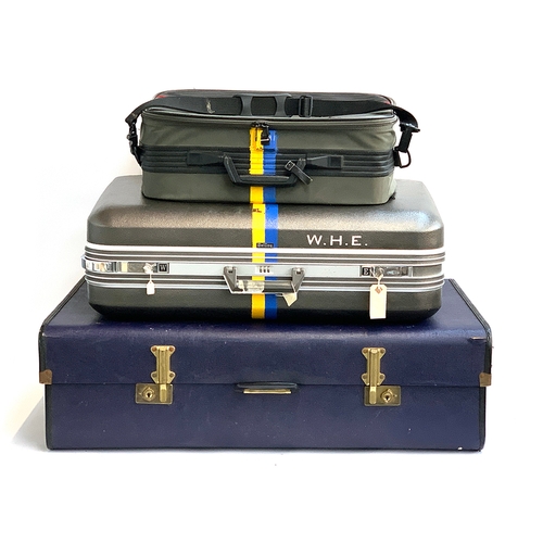 1093 - An Overpond suitcase, 91cmW; together with two other modern suitcases with blue and yellow painted s... 