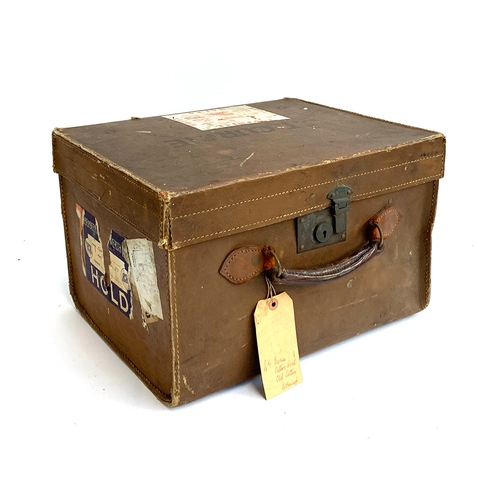 1094 - A small vintage suitcase with travel stickers, 42x35x27cm