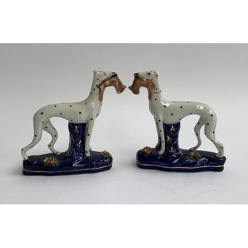 125 - A pair of Staffordshire greyhounds with quarry, spotted decoration, gilt highlight to base, 15cmH