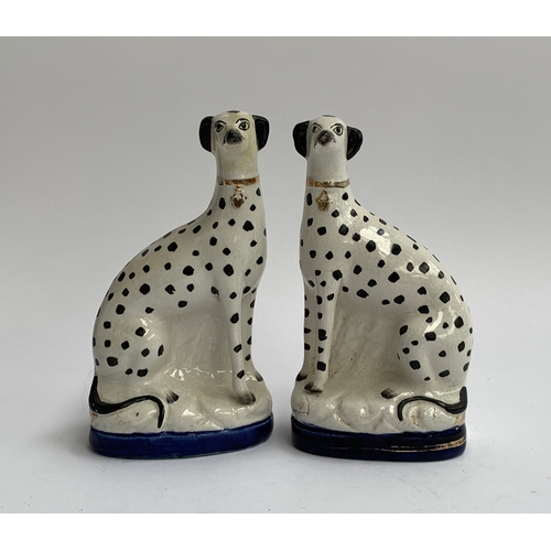 126 - A pair of Staffordshire greyhounds, with spot decoration, each approx. 19cmH