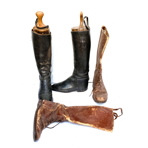 876 - A pair of black leather gent's hunting boots with trees and spur supports; together with a pair of b... 