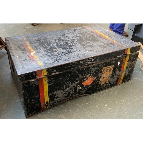 1095 - A metal travel trunk with hinged lid and travel stickers, double red and yellow stripe, 89x54x33cm