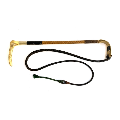 185 - A gent's whalebone hunting whip with leather thong and white metal collar, 56cmL, the thong and lash... 