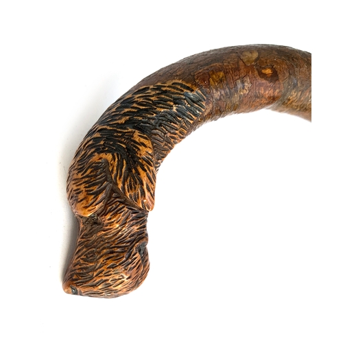 194 - In the style of Swaine & Adeney, a shooting stick with leather and canvas seat, the handle carved in... 