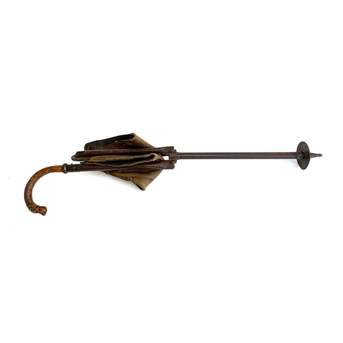 194 - In the style of Swaine & Adeney, a shooting stick with leather and canvas seat, the handle carved in... 