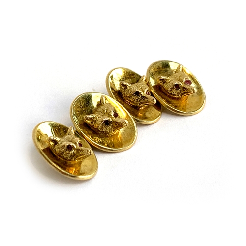 72 - A pair of 9ct gold fox mask cufflinks, by Cropp & Farr, London 1973, each with two fox masks with ru... 