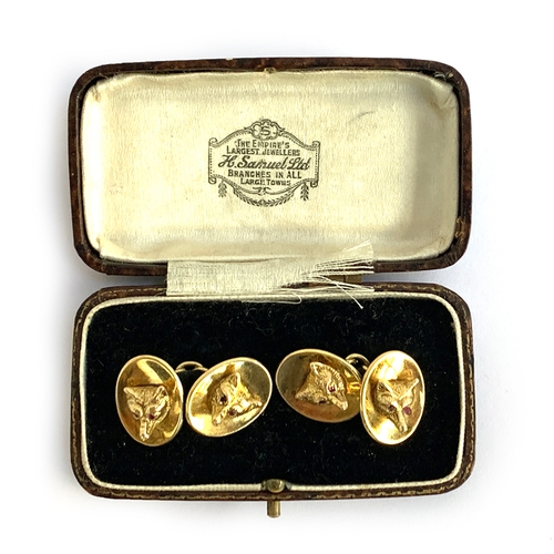 72 - A pair of 9ct gold fox mask cufflinks, by Cropp & Farr, London 1973, each with two fox masks with ru... 