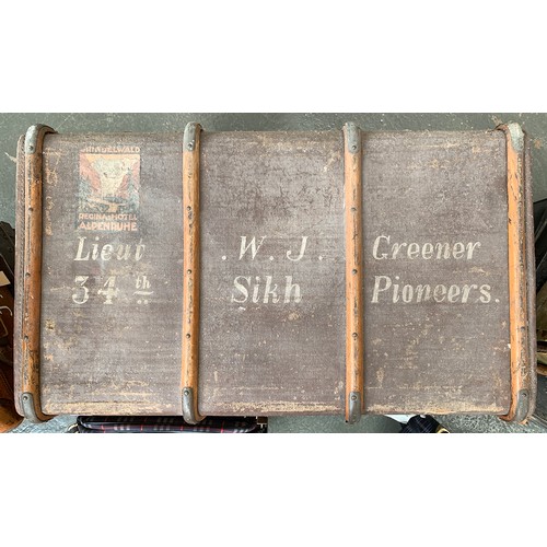 1079 - An Army and Navy woodbanded canvas travel trunk, marked Lt. W. J. Greener, 34th Sikh Pioneers