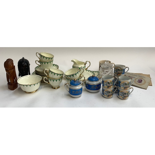 236 - A mixed lot to include Russian coffee set; Tuscan china part tea set; two African carved wooden head... 