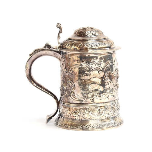 85 - A George I silver lidded tankard, by David Willaume I, London 1724, later chased, bearing the crest ... 