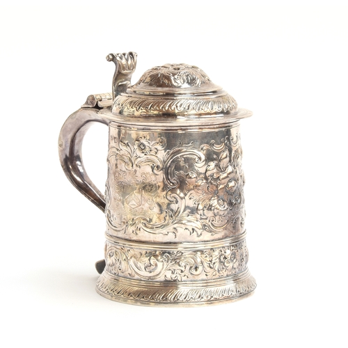 85 - A George I silver lidded tankard, by David Willaume I, London 1724, later chased, bearing the crest ... 