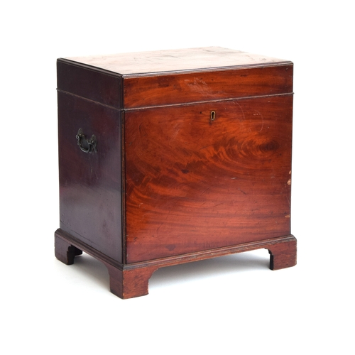 601 - A Regency mahogany cellarette of rectangular form, with twin brass carry handles, on bracket feet, t... 