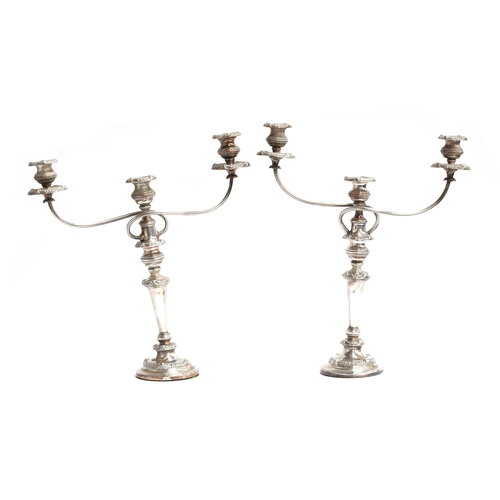 146 - A pair of George III silver candlesticks, S C Younge & Co, Sheffield 1813, with Old Sheffield Plate ... 