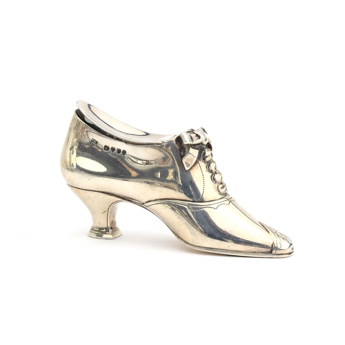 125 - A Victorian novelty silver vesta case in the form of a shoe, Edward H Stockwell, London 1877, 8.4cm ... 