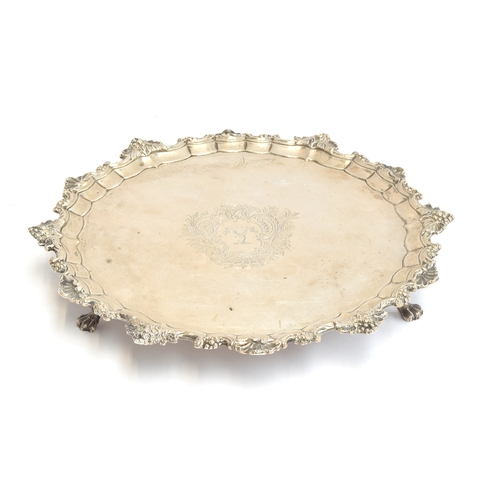 102 - A George II silver salver by John Robinson II, London 1744, central engraved crest within a shell mo... 