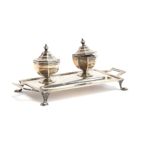 138 - A silver inkstand with two octagonal inkwells by Asprey, Sheffield 1911, each well with hinged lid a... 