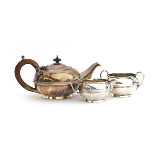 74 - A George V silver three piece tea set by S W Smith & Co, Birmingham 1919, comprising teapot, sugar b... 