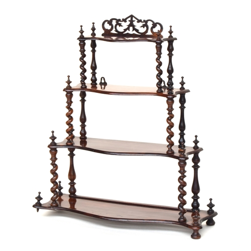 567 - A Victorian rosewood four tier whatnot, each shaped shelf on barleytwist supports, 68cm wide, 77cm h... 