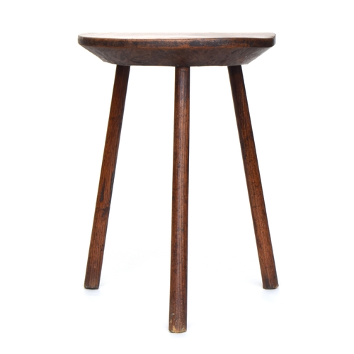 549 - An early provincial 'cricket' table, the exceptionally thick circular oak top on three splayed legs,... 