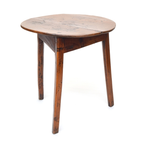 550 - An early 19th century ash and elm cricket table, the three plank circular top on three splayed legs,... 