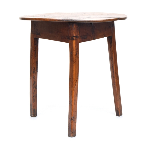 550 - An early 19th century ash and elm cricket table, the three plank circular top on three splayed legs,... 