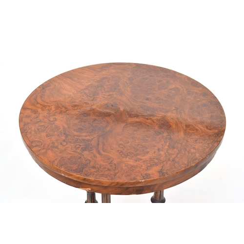 561 - A 19th century pollard oak veneer circular occasional table, raised on three reeded turned supports ... 