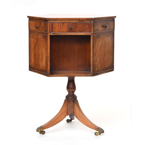 562 - A 19th century rotating hexagonal mahogany library work table, three drawers and three blind, on thr... 