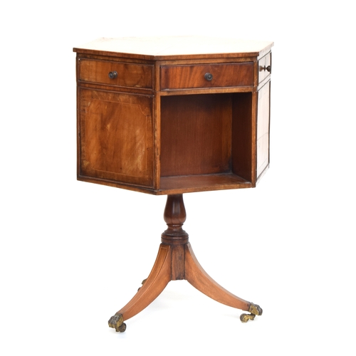 562 - A 19th century rotating hexagonal mahogany library work table, three drawers and three blind, on thr... 