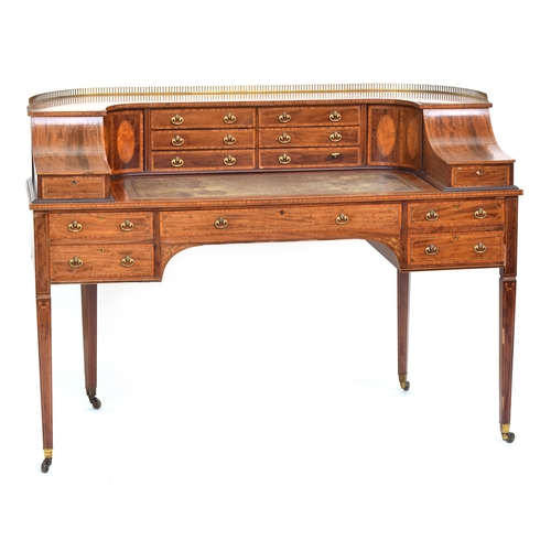 587 - A 19th century Carlton House writing desk, with a galleried super structure and an arrangement of sh... 