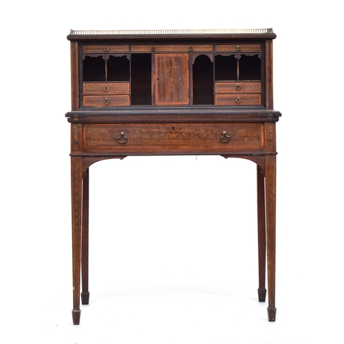 594 - A Victorian ladies writing desk, the galleried superstructure with an arrangement of drawers and pig... 