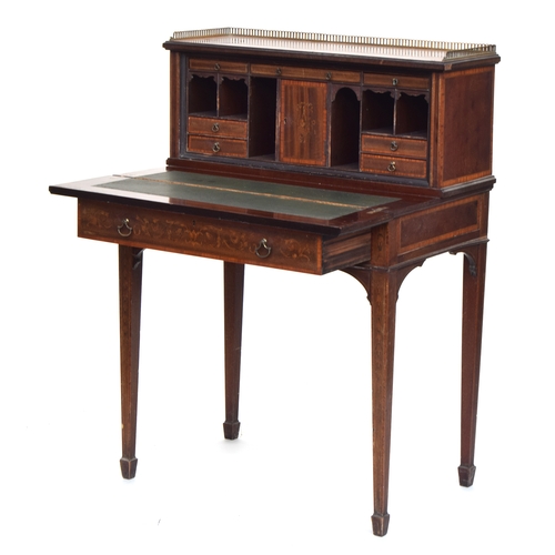 594 - A Victorian ladies writing desk, the galleried superstructure with an arrangement of drawers and pig... 