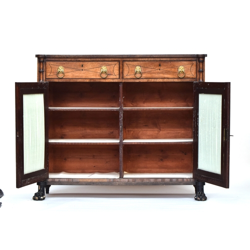 547 - A 19th century credenza, two drawers with lion mask loop handles over two pleated silk doors, openin... 