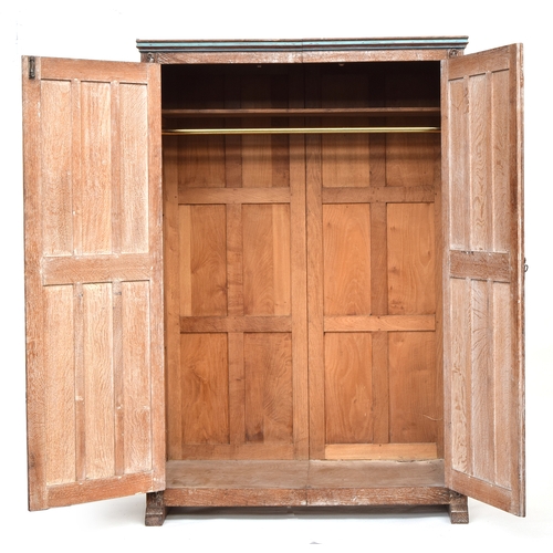 600 - An Arts and Crafts limed oak and parcel painted bedroom suite, comprising pot cupboard 33x38x76cm; c... 