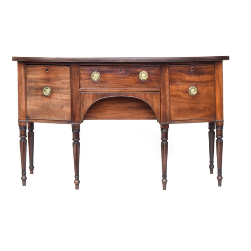 546 - A Regency mahogany bow front sideboard, top with reeded edge, over two central drawers flanked by tw... 