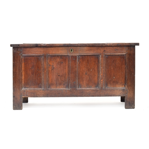 516 - A late 17th/early 18th century oak four panel coffer, 128cm wide, 52cm deep, 85cm high