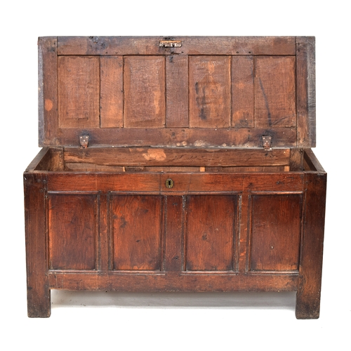 516 - A late 17th/early 18th century oak four panel coffer, 128cm wide, 52cm deep, 85cm high