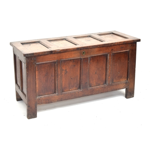 516 - A late 17th/early 18th century oak four panel coffer, 128cm wide, 52cm deep, 85cm high