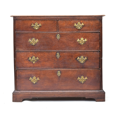 523 - A George II oak chest of drawers, the moulded two plank top over two short and three long drawers wi... 