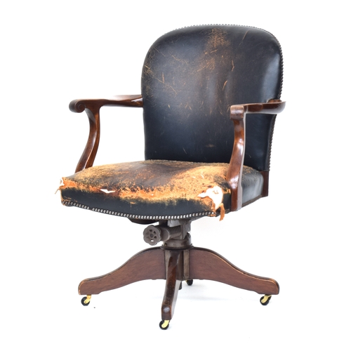 607 - A 20th century green leather and mahogany swivel desk chair, the base marked 'Hillcrest Chair Action... 