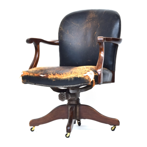 607 - A 20th century green leather and mahogany swivel desk chair, the base marked 'Hillcrest Chair Action... 