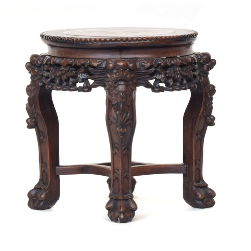 624 - A 19th century Chinese hardwood jardiniere stand, with circular inset marble top, on four carved leg... 