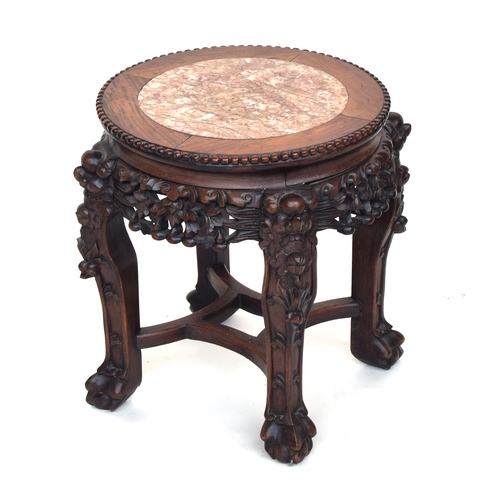 624 - A 19th century Chinese hardwood jardiniere stand, with circular inset marble top, on four carved leg... 