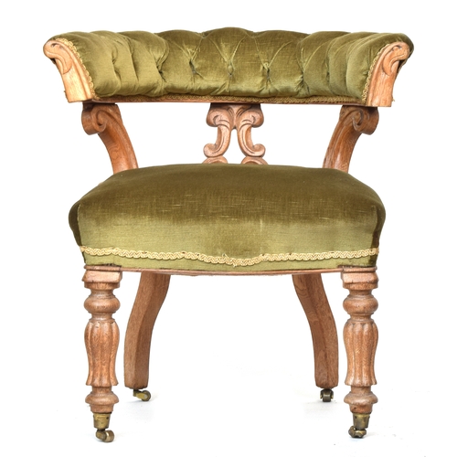 606 - A Continental carved desk chair, upholstered in green cord