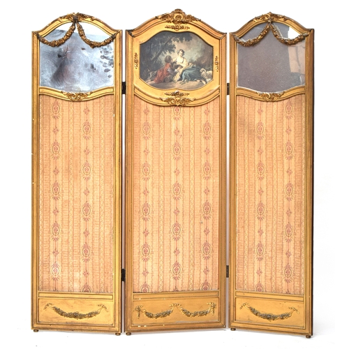 571 - A 19th century French three fold giltwood and gesso screen, the two outer panels with floral swags o... 