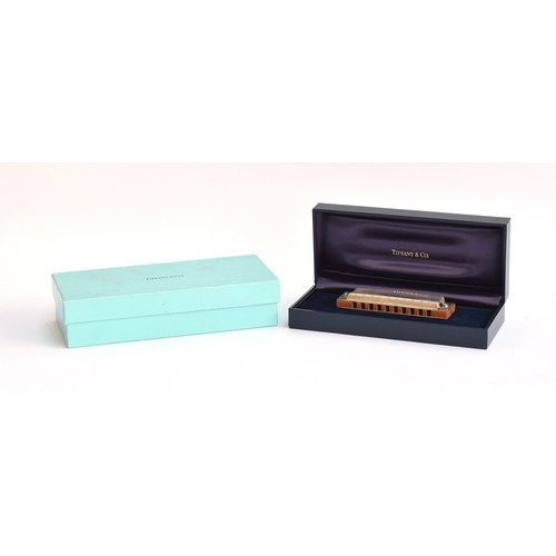 128 - A Tiffany & Co. 925 silver harmonica made by Hohner, in case and box; together with a Tiffany & Co. ... 