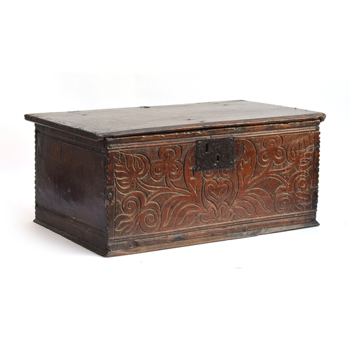 513 - A 17th century oak bible box, with floral carving, 60.5cm wide, 35.5cm deep, 26cm high