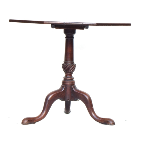 552 - An octagonal Regency tip top table, on gun barrel and wrythen base, raised on cabriole legs with poi... 