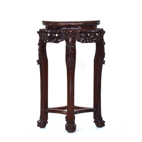 626 - A 19th century Chinese hardwood and mother of pearl jardiniere stand, with circular inset marble top... 