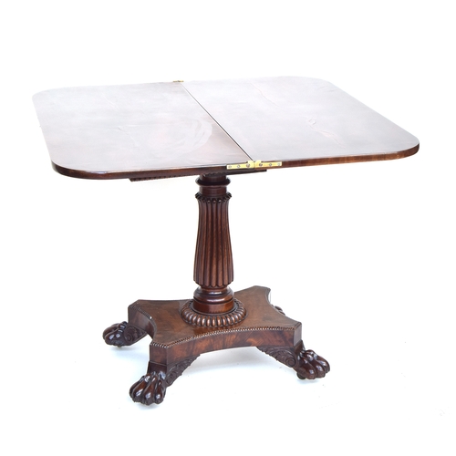 558 - A Victorian mahogany swivel top card table, on carved fluted column, rectangular base, and four pad ... 